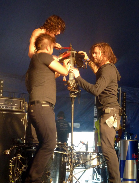 Three of Nothing More playing the bass Download Festival 2014